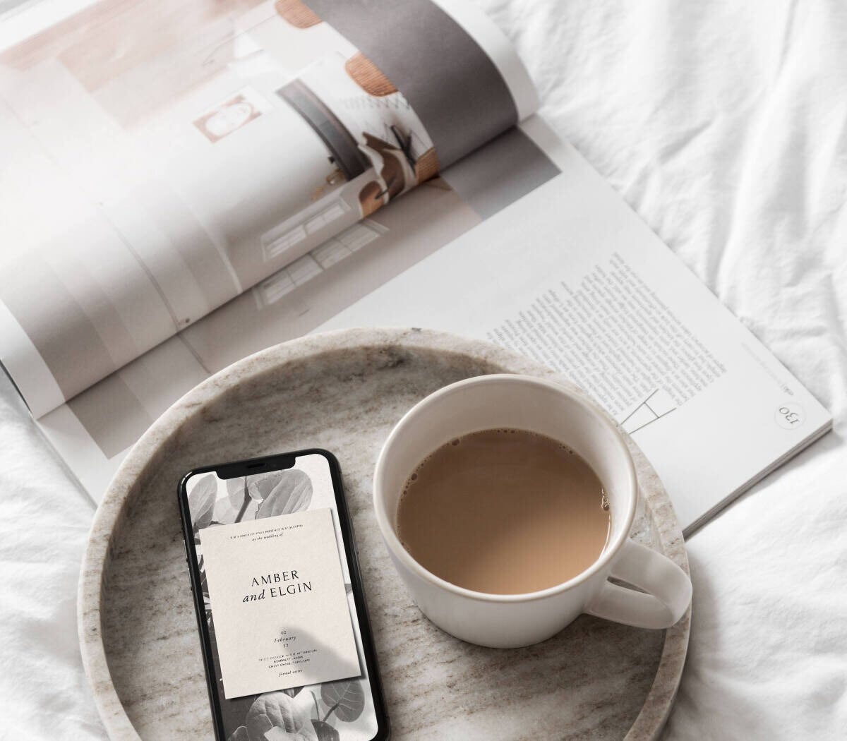 A leaf-covered online wedding invitation displayed on a phone