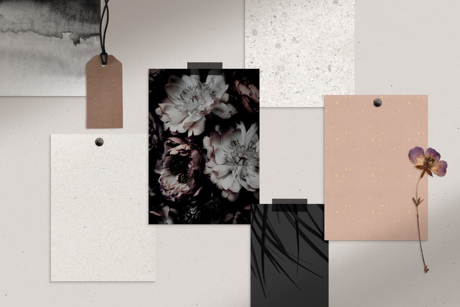 A flat lay displaying different types of solid and patterned wedding invitation backgrounds